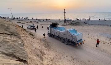 Gaza: premiers déchargements de 300 palettes d'aide humanitaire sur la côte, offensive en cours au nord