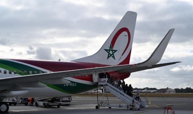 Des personnes embarquent à bord d'un vol Royal Air Maroc, le 15 juillet 2020 à l'aéroport de Bordeaux. (Photo, AFP)